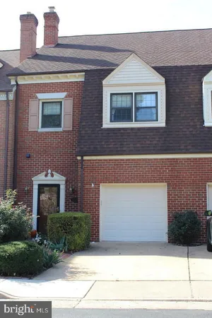 a front view of a house with yard