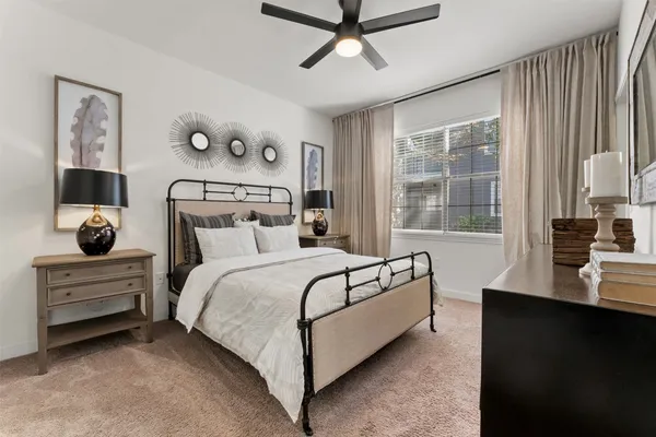 a bedroom with a bed and window