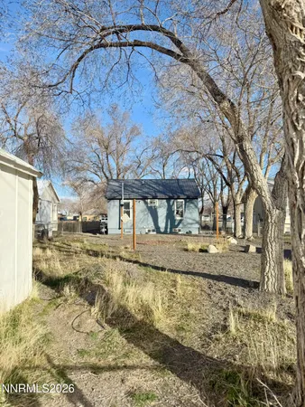 a view of a yard with a house