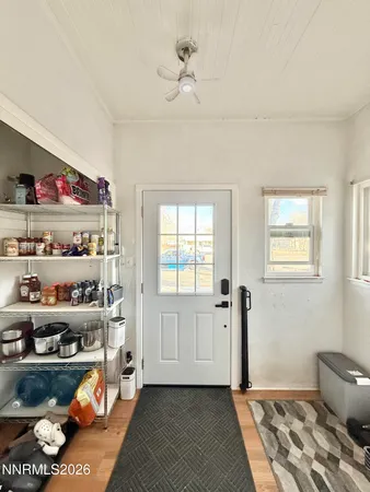 a bedroom with furniture and a book shelf