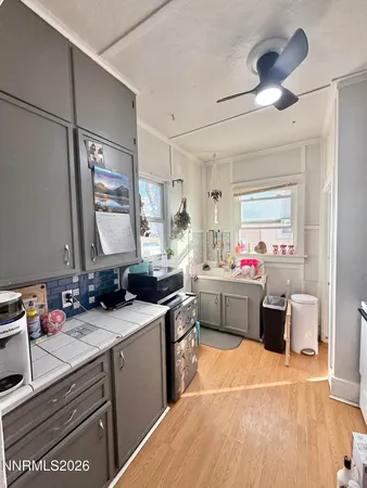 a kitchen with a sink cabinets and appliances