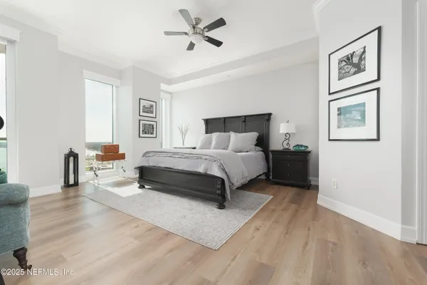 a bedroom with a bed a couch and a couch