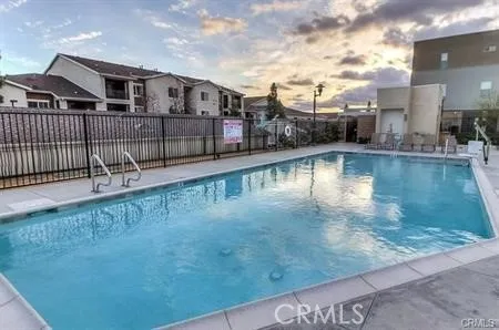 a view of a swimming pool with a deck