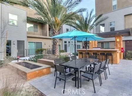 a view of a dinning table and chairs in the patio