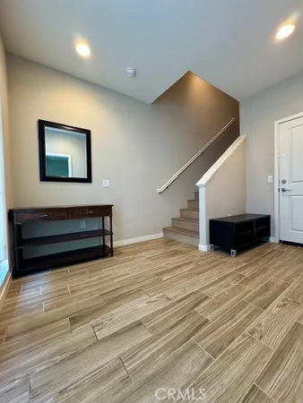 a view of kitchen and empty room