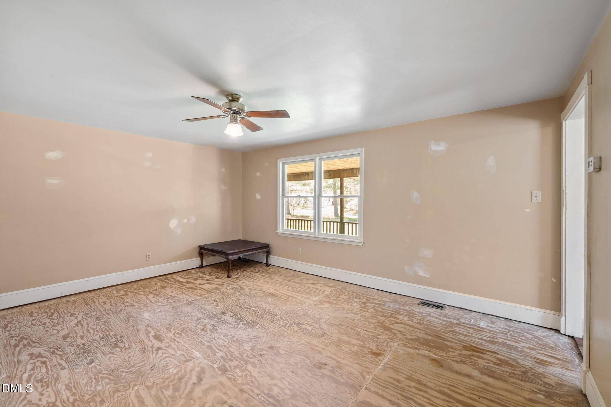 212 Thomas Humphries Road Roxboro, NC 27574 - Photo 22 of 56 an empty room with windows and ceiling fan