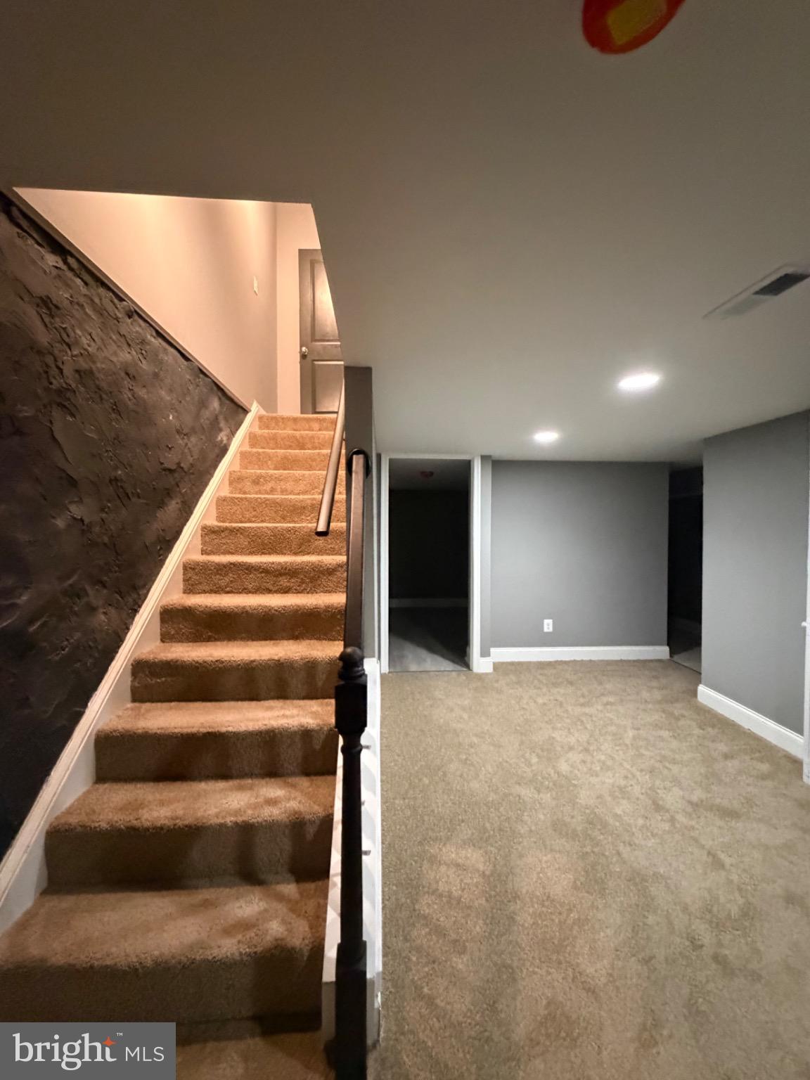 3427 Dupont Avenue Baltimore, MD 21215 - Photo 11 of 16 Inviting basement retreat with modern charm.