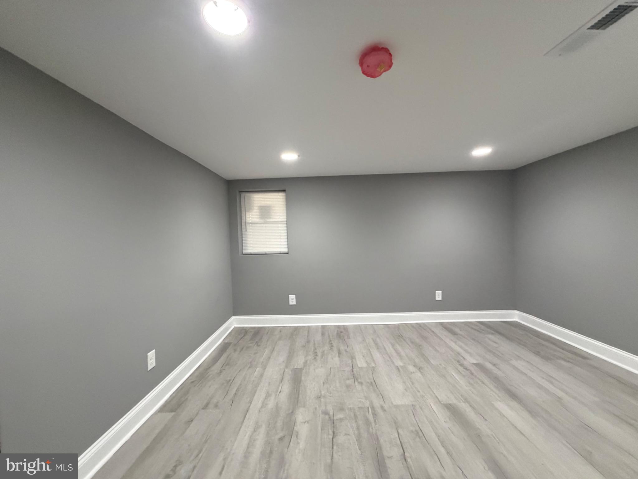 3427 Dupont Avenue Baltimore, MD 21215 - Photo 13 of 16 Versatile space with modern gray tones.