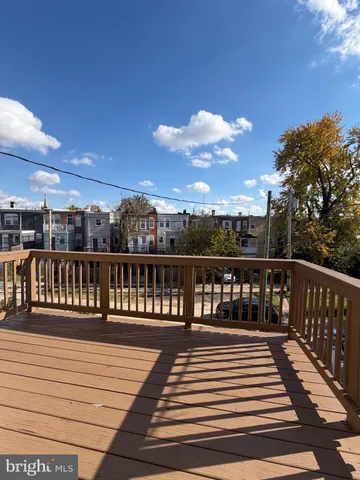 a view of a balcony with wooden floor