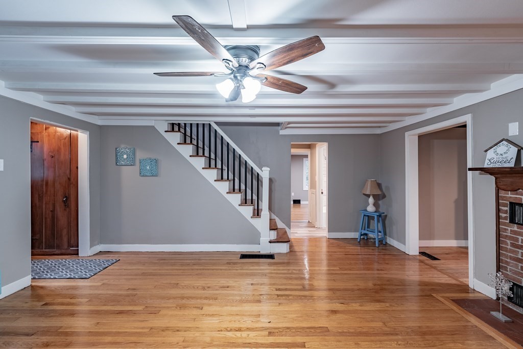 939 Monson Road Wilbraham, MA 01095 - Photo 3 of 31 a view of a livingroom with wooden floor and a ceiling fan