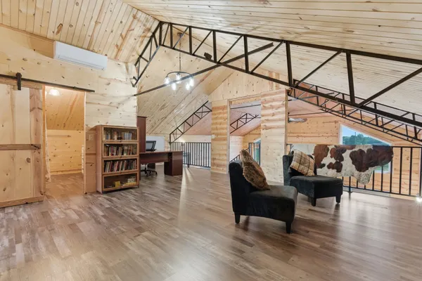 a living room with furniture and wooden floors