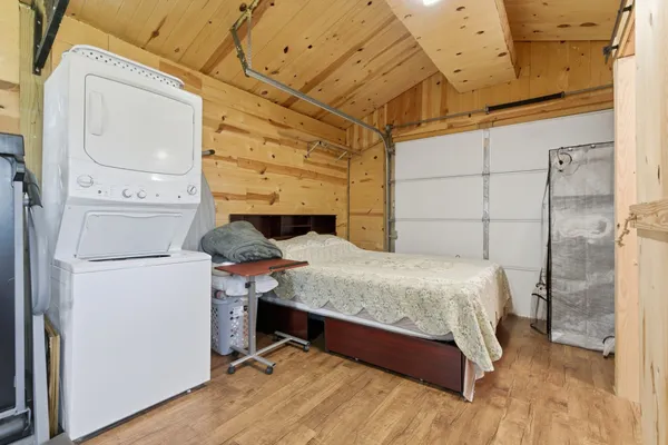 a bedroom with a bed and a table