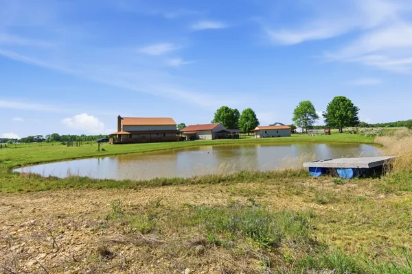 a view of a lake with houses in the back