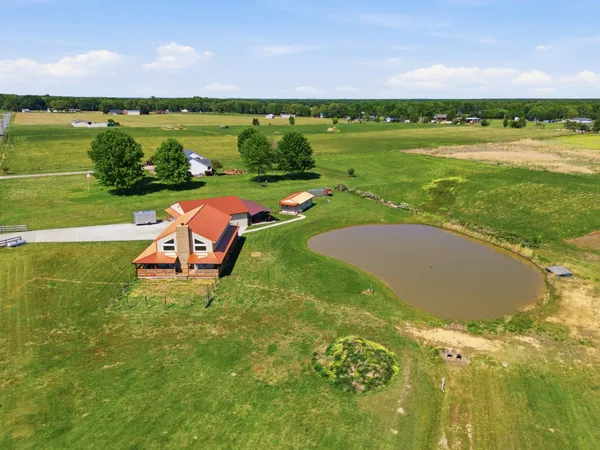 a view of a lake with a yard