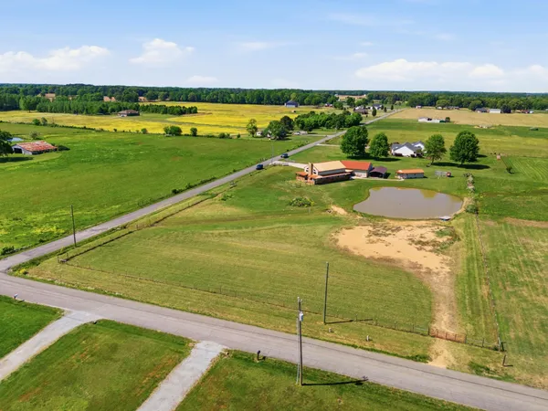 a view of a field with an ocean view