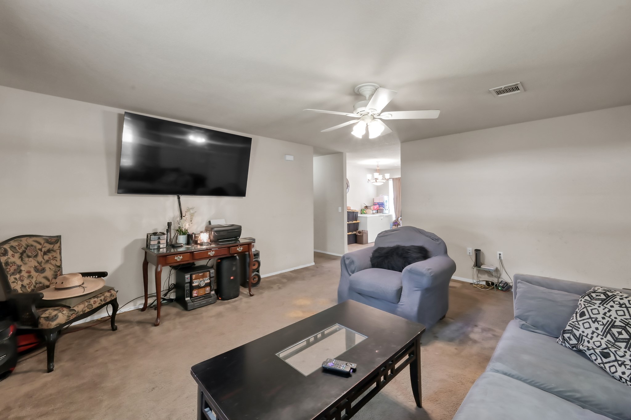 805 Webb Street Conroe, TX 77301 - Photo 6 of 19 a living room with furniture and a flat screen tv