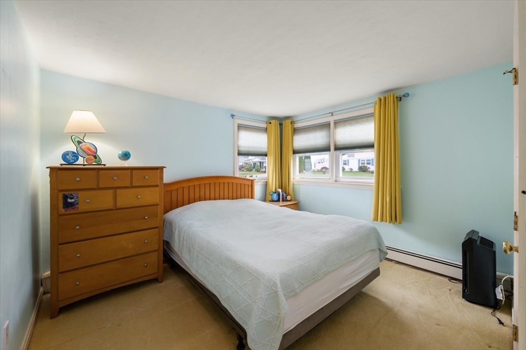 8 Stanley Street Natick, MA 01760 - Photo 15 of 35 a bedroom with a bed and a dresser
