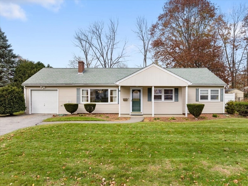 8 Stanley Street Natick, MA 01760 - Photo 33 of 35 a front view of a house with a yard and trees