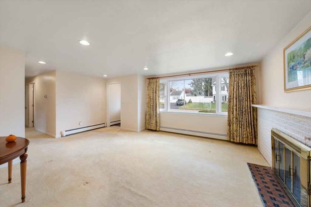 8 Stanley Street Natick, MA 01760 - Photo 4 of 35 a view of an empty room with a window