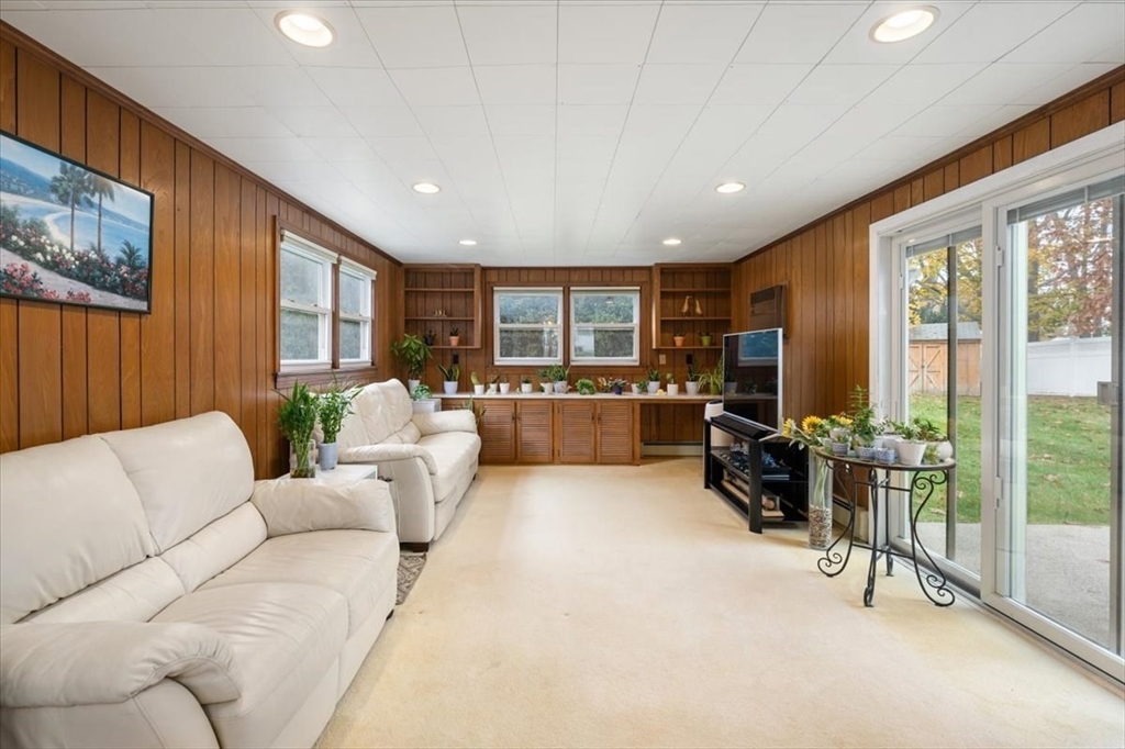 8 Stanley Street Natick, MA 01760 - Photo 5 of 35 a living room with furniture and a flat screen tv