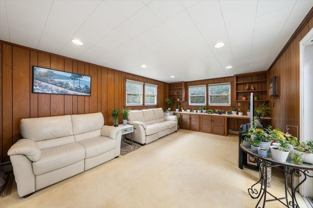 8 Stanley Street Natick, MA 01760 - Photo 7 of 35 a living room with furniture and a flat screen tv