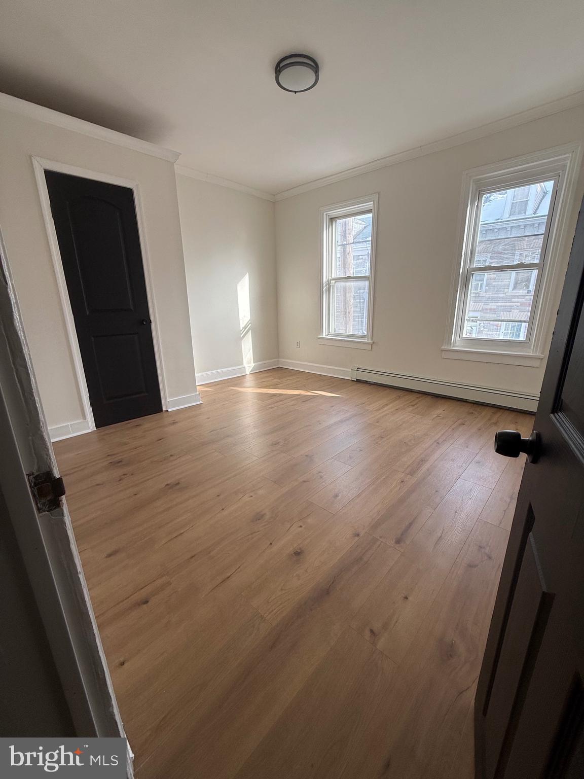 542 Moss Street Reading, PA 19604 - Photo 11 of 19 a view of a room with window and wooden floor