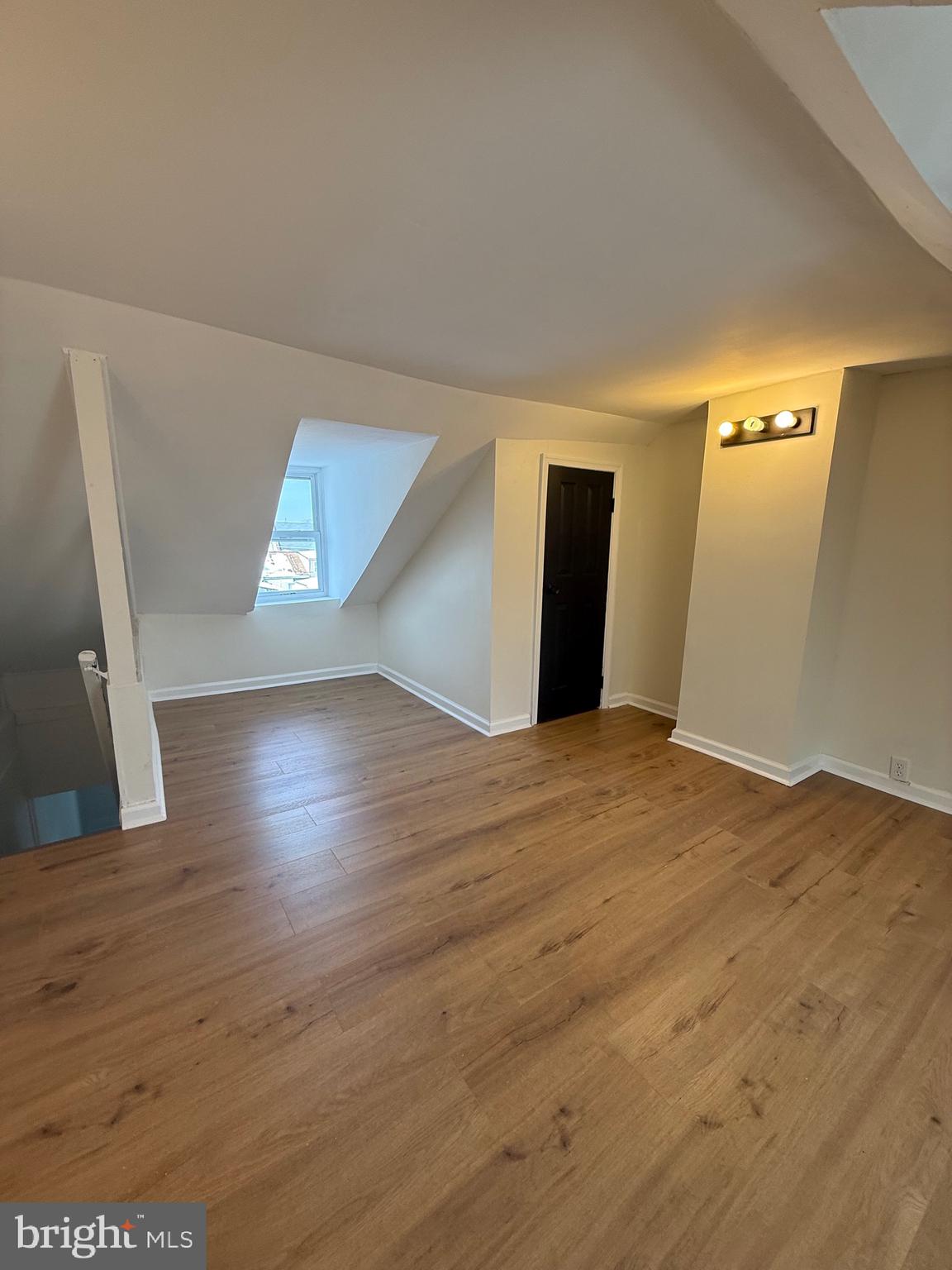 542 Moss Street Reading, PA 19604 - Photo 17 of 19 a view of empty room with wooden floor