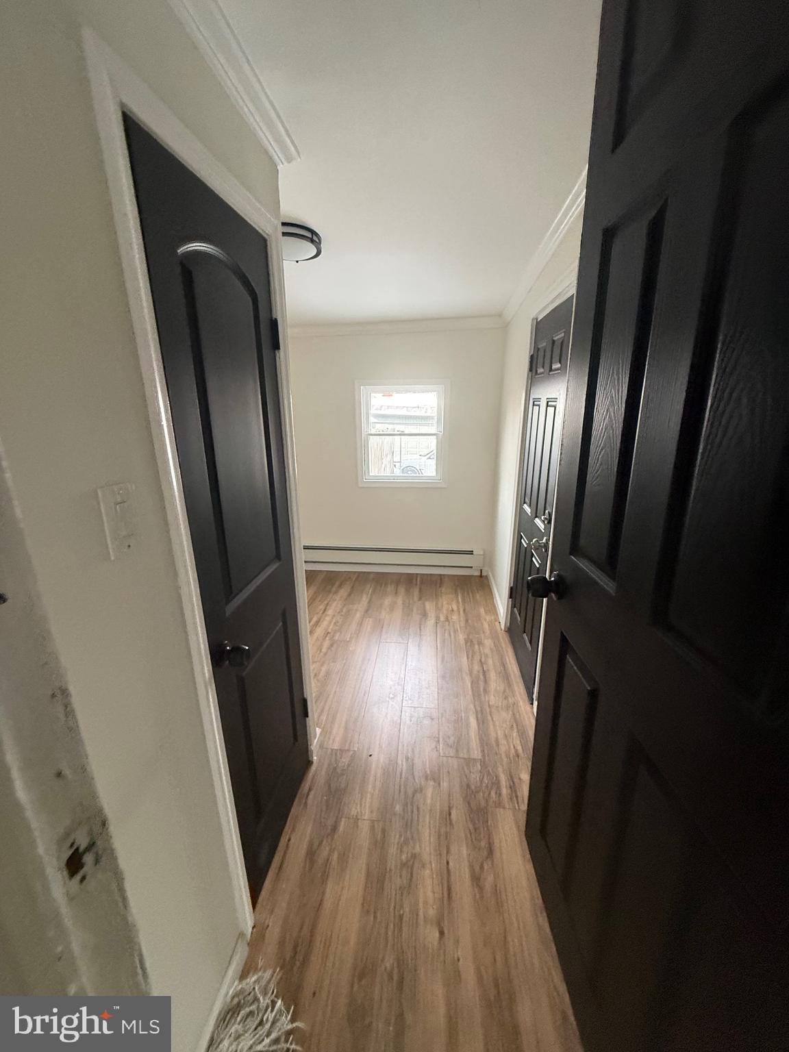 542 Moss Street Reading, PA 19604 - Photo 9 of 19 a view of a hallway with wooden floor