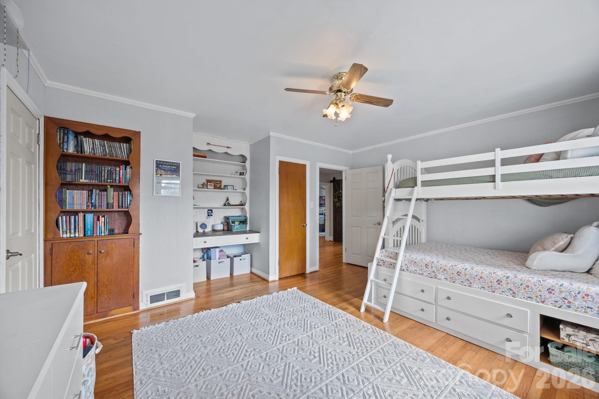 275 Tanner Street Rutherfordton, NC 28139 - Photo 42 of 44 a bed room with a bed and a book shelf