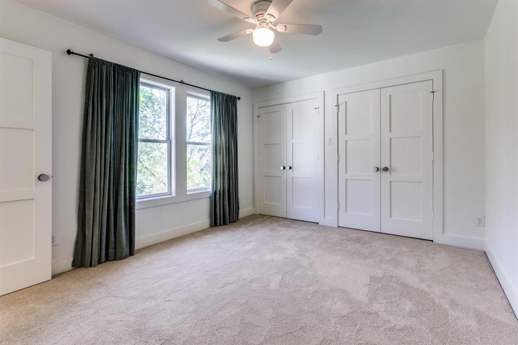 4206 Manning Lane Dallas, TX 75220 - Photo 28 of 35 a view of an empty room with chandelier fan and fire place