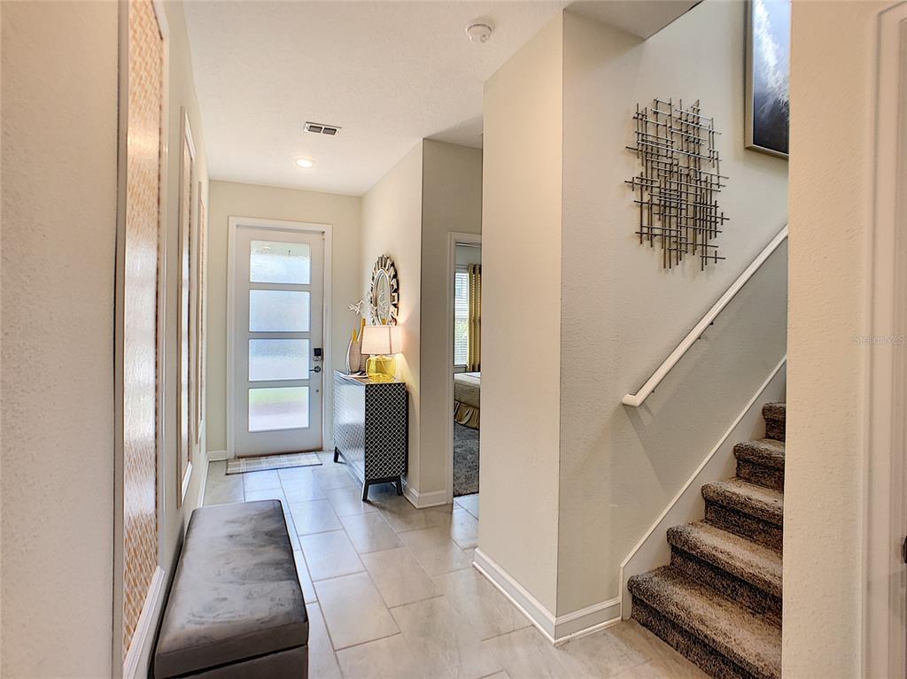 2736 Bookmark Drive Kissimmee, FL 34746 - Photo 18 of 35 a view of entryway and hall with wooden floor