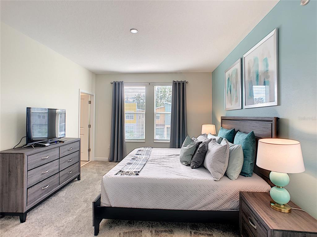 2736 Bookmark Drive Kissimmee, FL 34746 - Photo 22 of 35 a bedroom with a bed and window