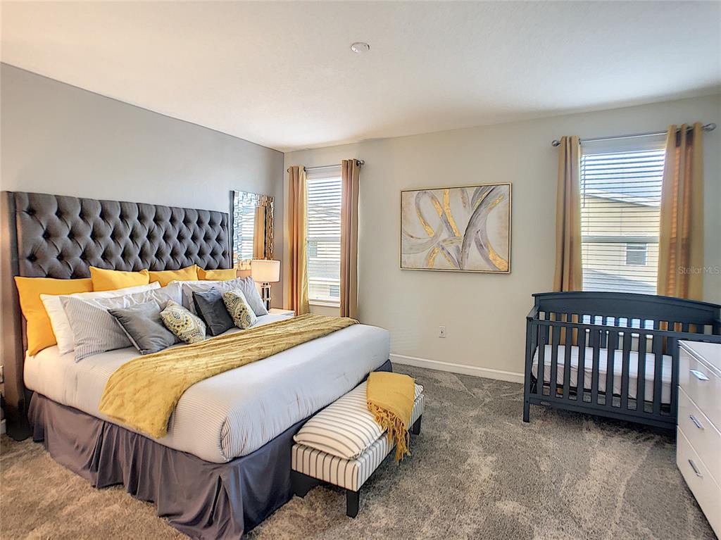 2736 Bookmark Drive Kissimmee, FL 34746 - Photo 24 of 35 a bedroom with a bed window and a couch
