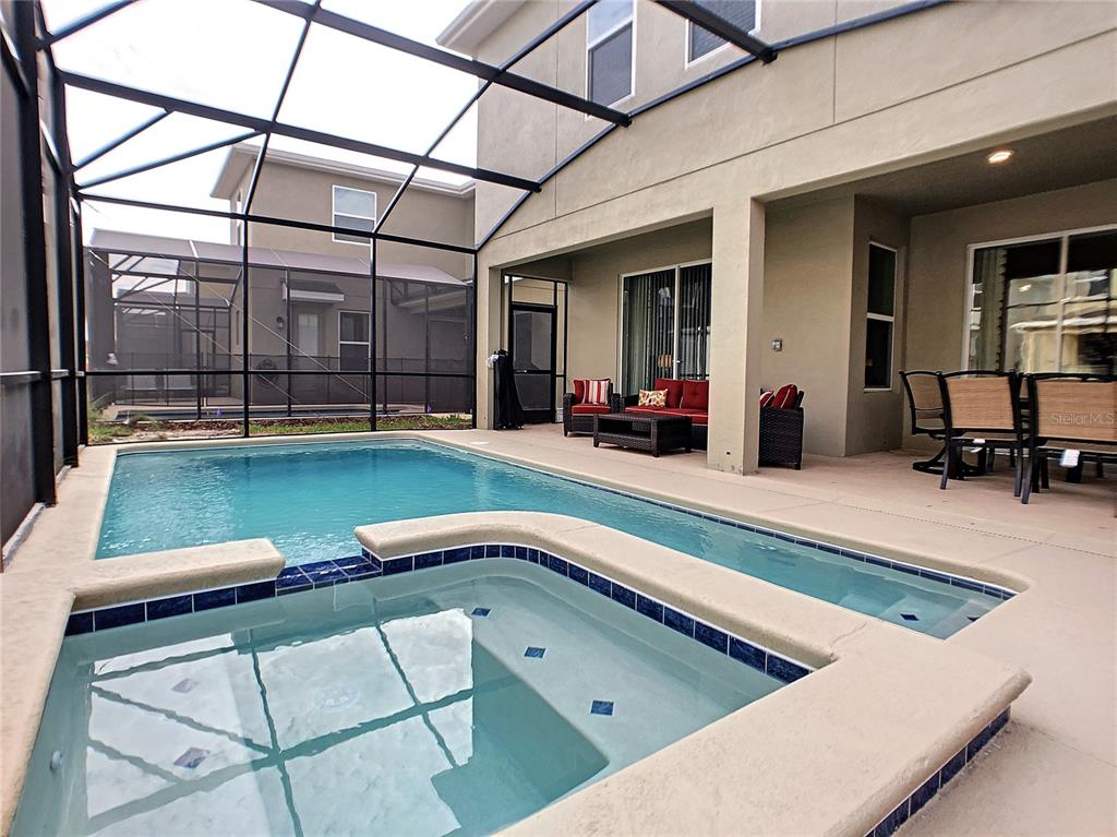 2736 Bookmark Drive Kissimmee, FL 34746 - Photo 27 of 35 a view of swimming pool with outdoor seating
