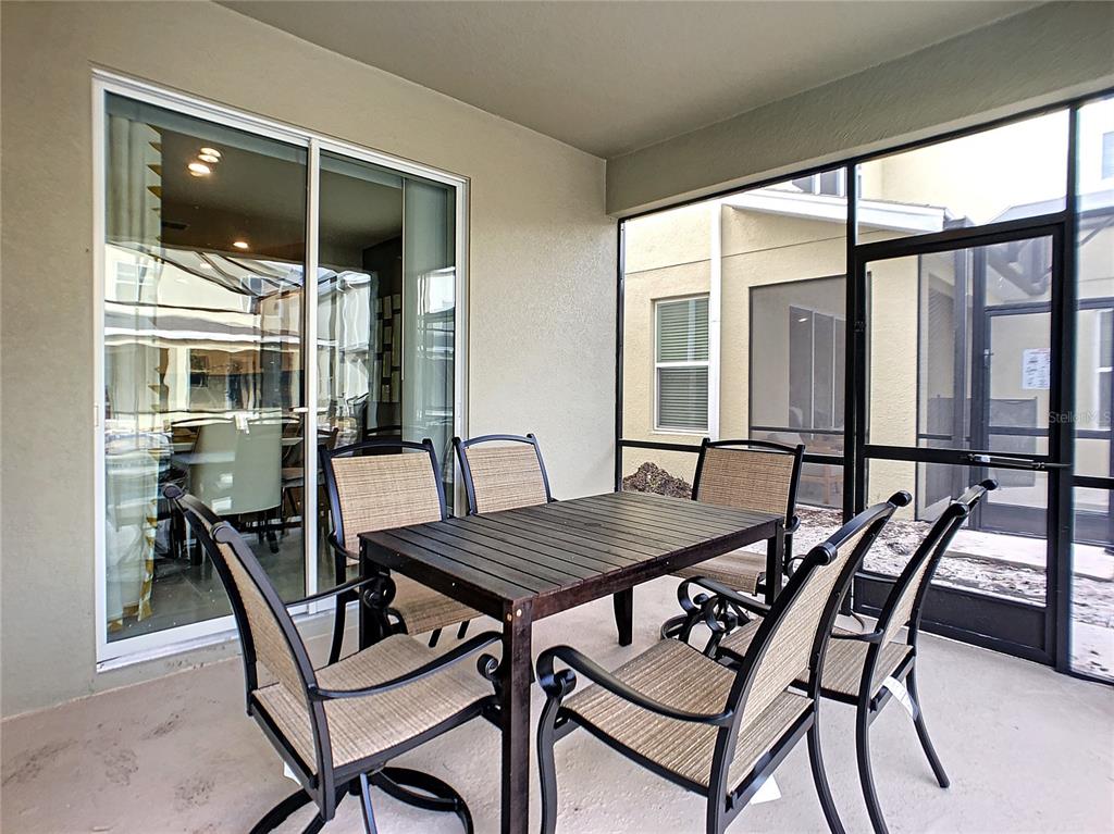 2736 Bookmark Drive Kissimmee, FL 34746 - Photo 29 of 35 a view of a dining room with furniture and window