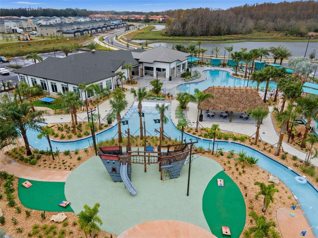 2736 Bookmark Drive Kissimmee, FL 34746 - Photo 31 of 35 an aerial view of a swimming pool with a table and chairs