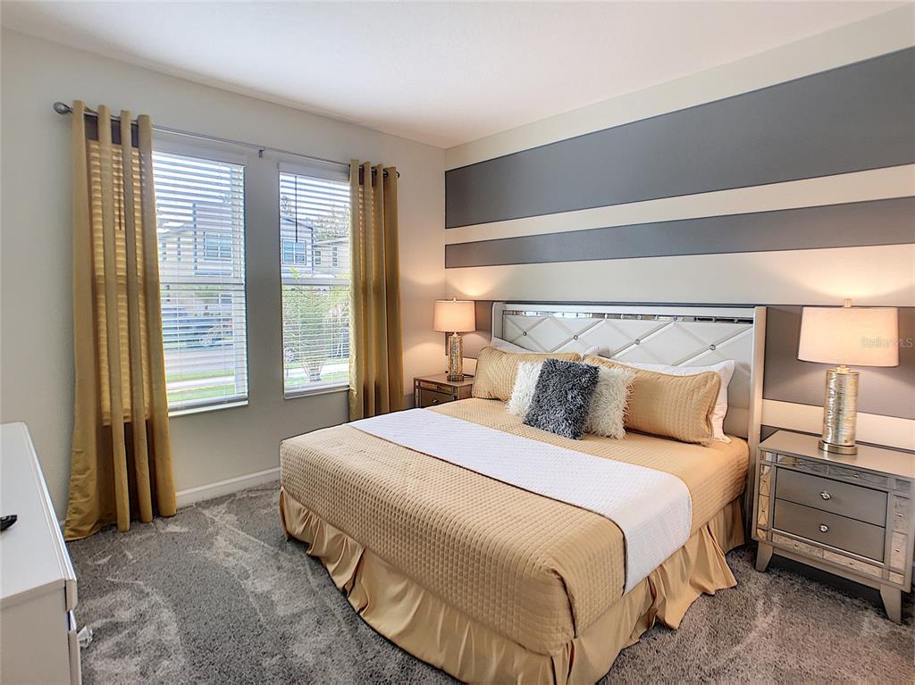2736 Bookmark Drive Kissimmee, FL 34746 - Photo 9 of 35 a bedroom with a bed and large window