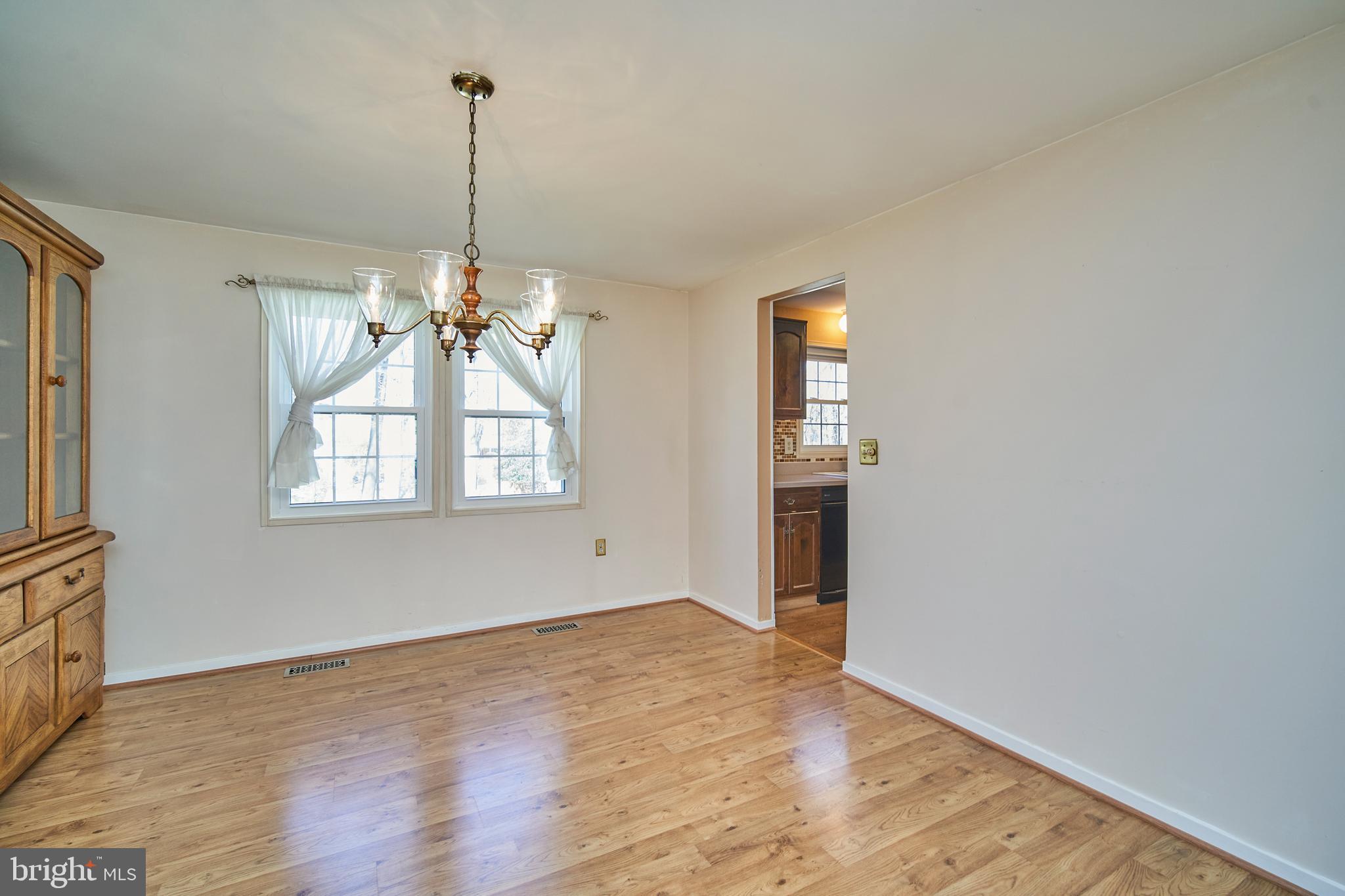 9512 Burning Branch Road Burke, VA 22015 - Photo 7 of 30 Formal Dining Room w/ Hardwood Floors