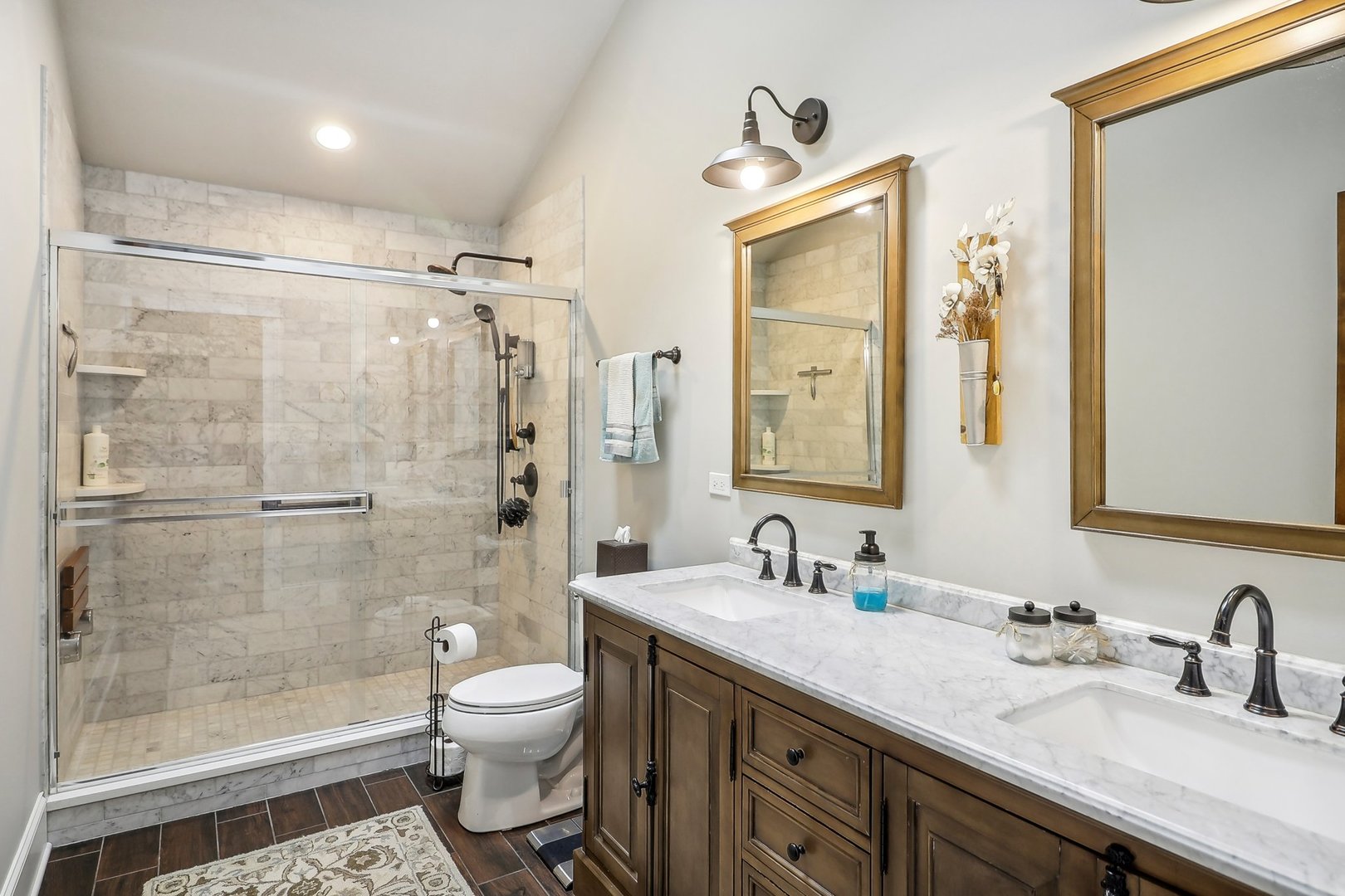 22517 Grange Road Marengo, IL 60152 - Photo 19 of 39 a bathroom with a granite countertop sink toilet a shower and a mirror
