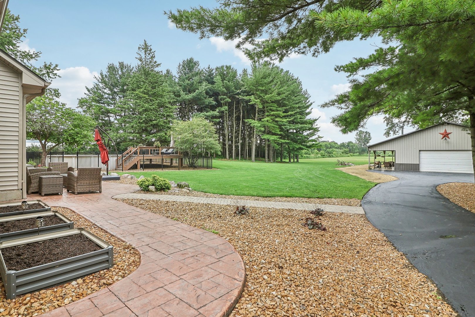 22517 Grange Road Marengo, IL 60152 - Photo 3 of 39 a view of a backyard with a garden