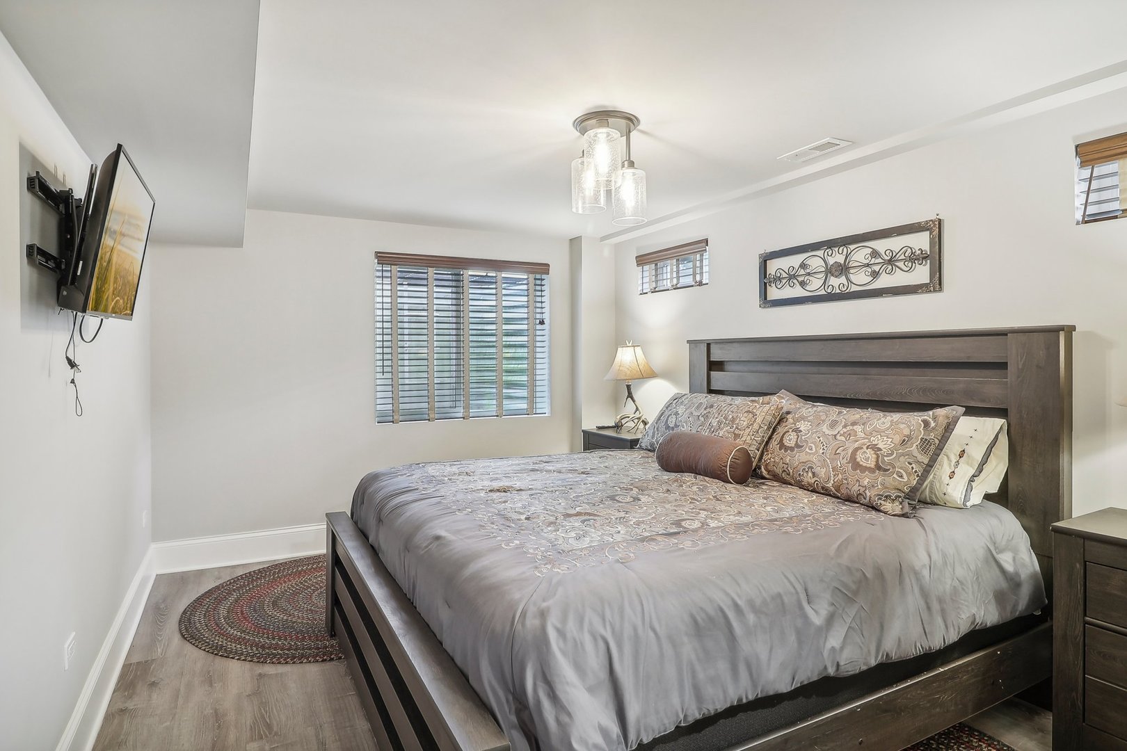 22517 Grange Road Marengo, IL 60152 - Photo 31 of 39 a bedroom with a bed and a flat screen tv