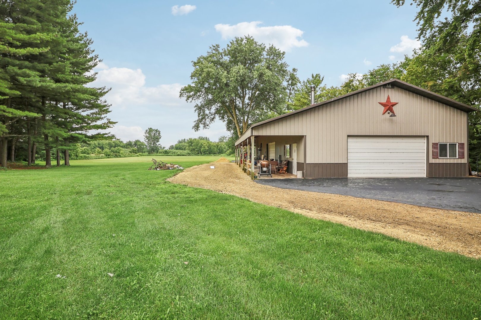 22517 Grange Road Marengo, IL 60152 - Photo 4 of 39 a view of a backyard with a garden and plants