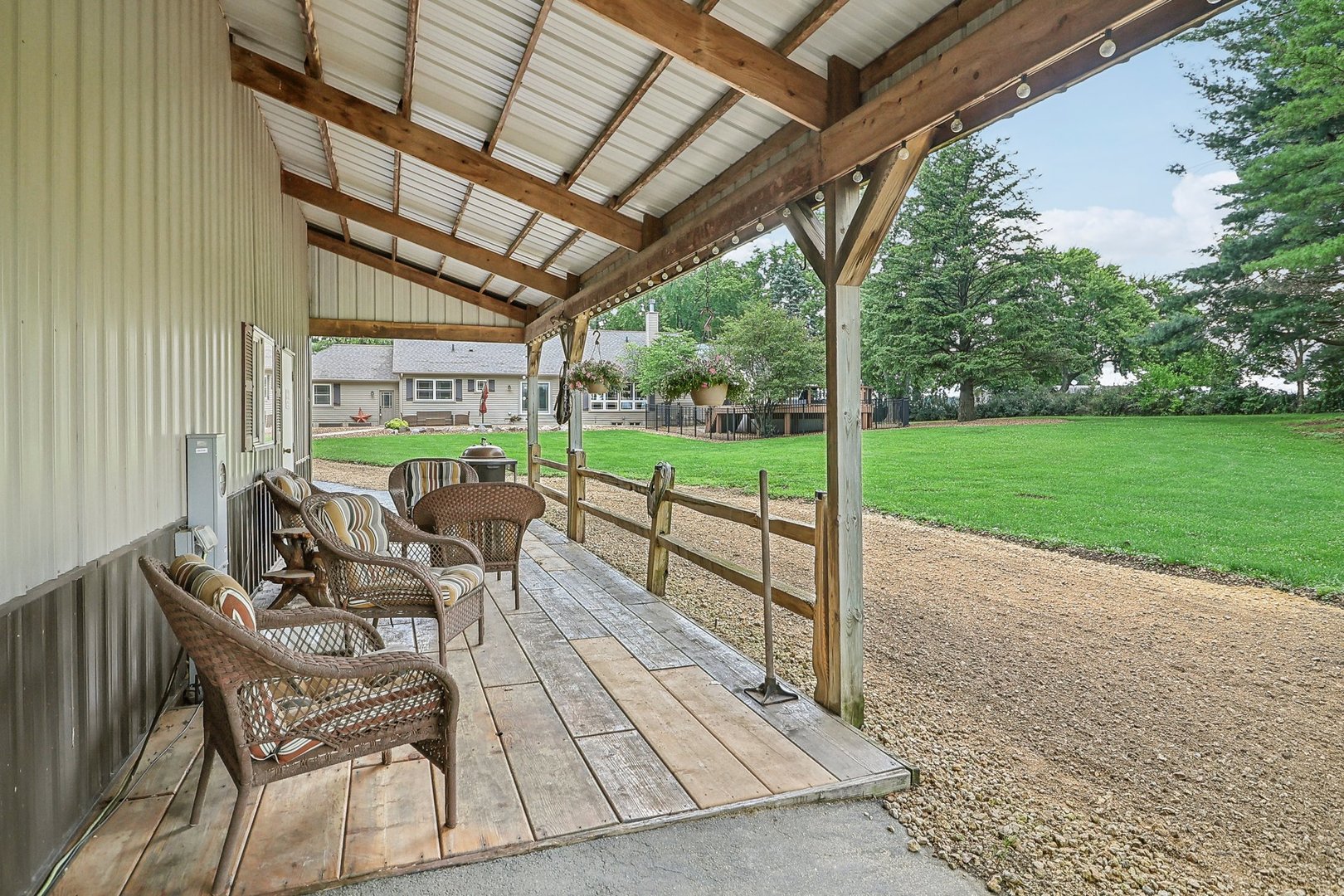 22517 Grange Road Marengo, IL 60152 - Photo 5 of 39 a view of a patio with table and chairs and potted plants