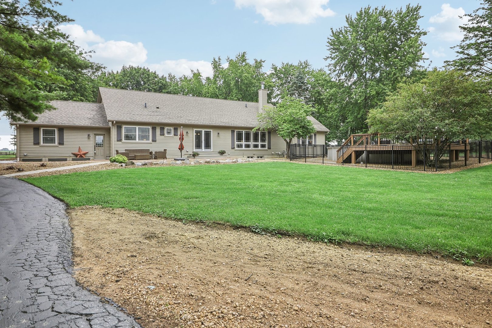 22517 Grange Road Marengo, IL 60152 - Photo 8 of 39 a view of a house with a big yard and large trees