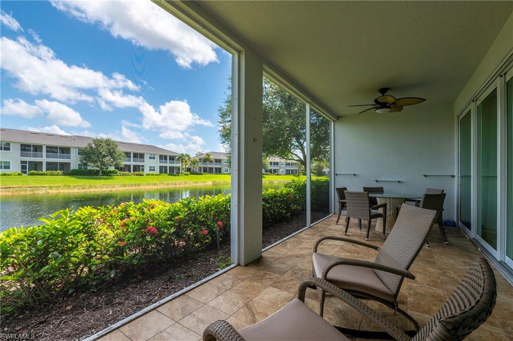 6954 Avalon Circle, Unit 702 Naples, FL 34112 - Photo 27 of 40 a view of a chairs and table in patio
