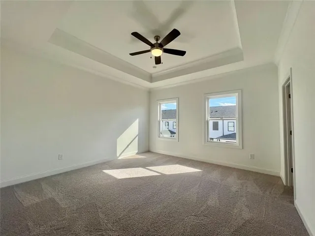 a view of a livingroom with a ceiling fan and window
