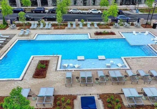 a view of a backyard with sitting area