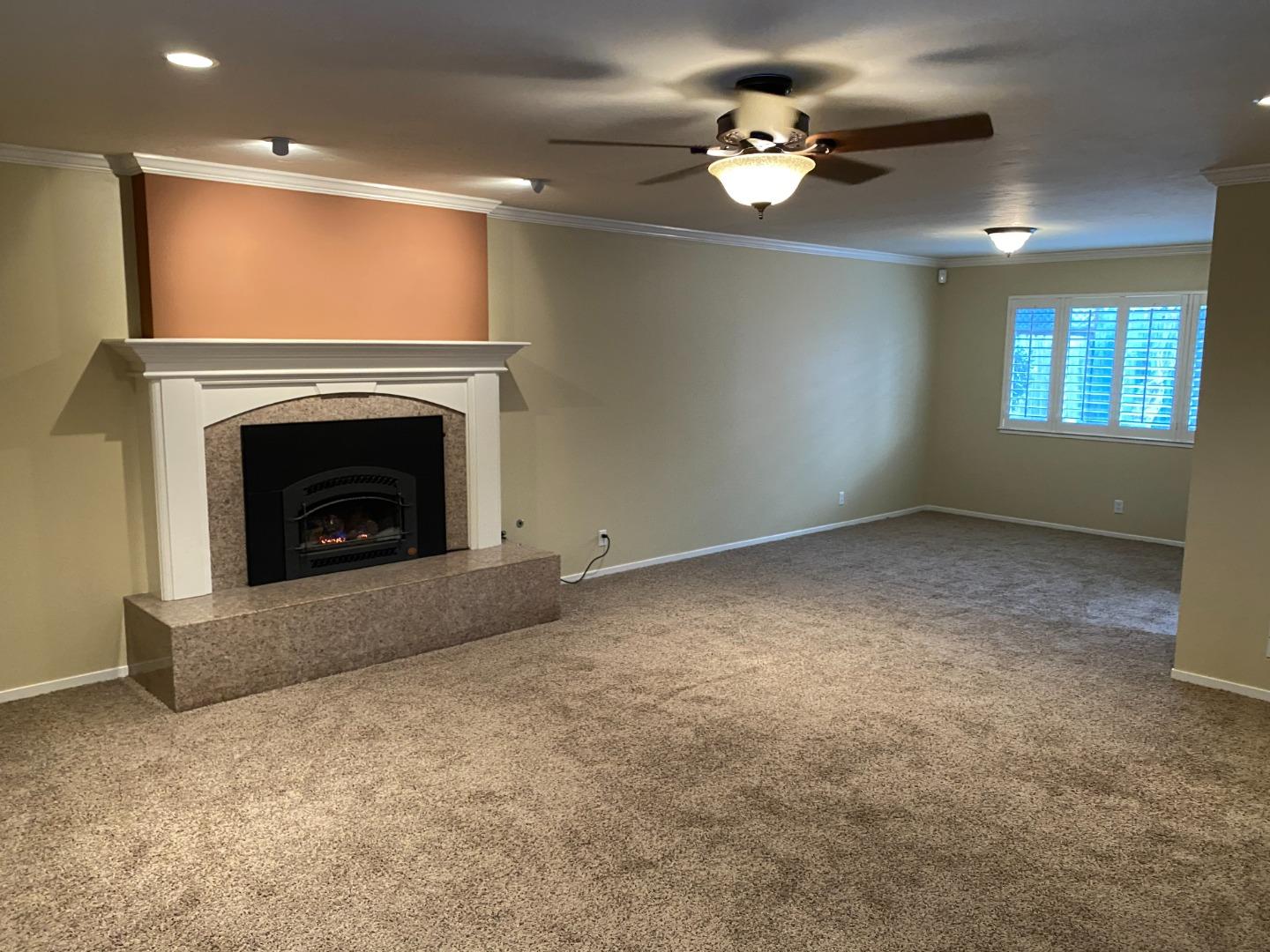 727 Montecito Way Salinas, CA 93901 - Photo 5 of 19 a view of empty room with fireplace and fan