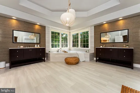 a living room with a couch and a dresser with wooden floor