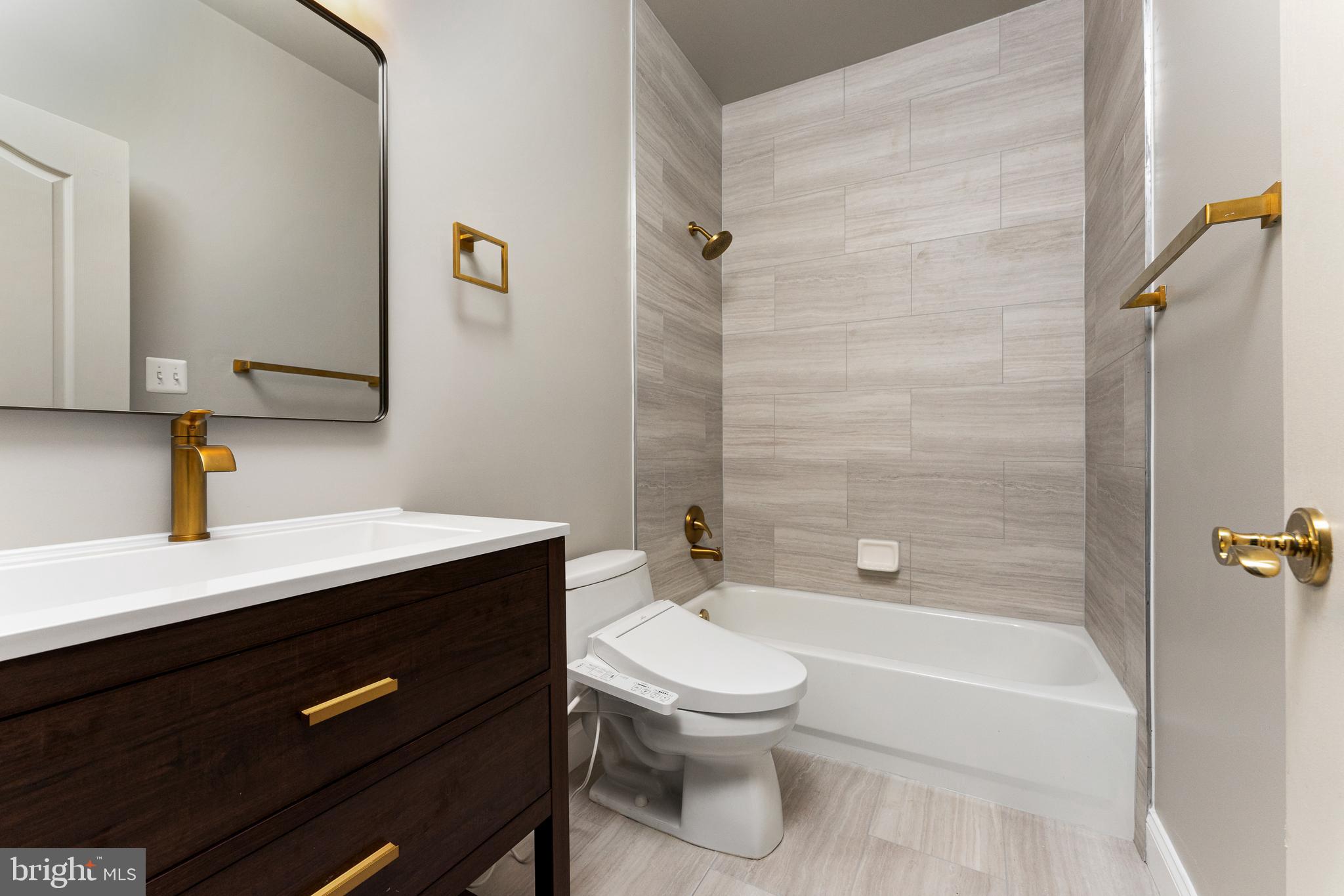 1445 Mayhurst Boulevard McLean, VA 22102 - Photo 27 of 31 a bathroom with a sink a toilet and shower